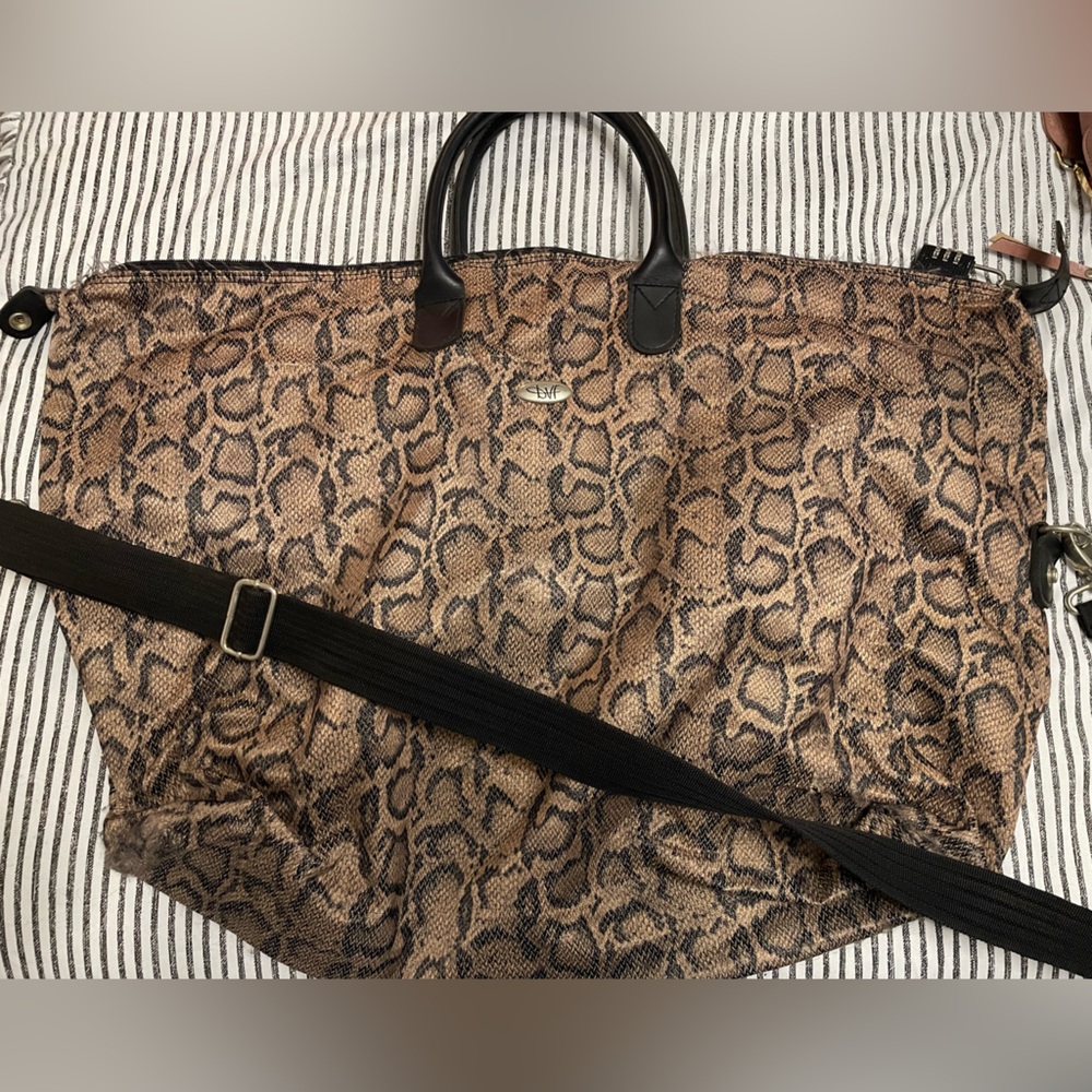 Travel bag, with lock, used, cheetah print